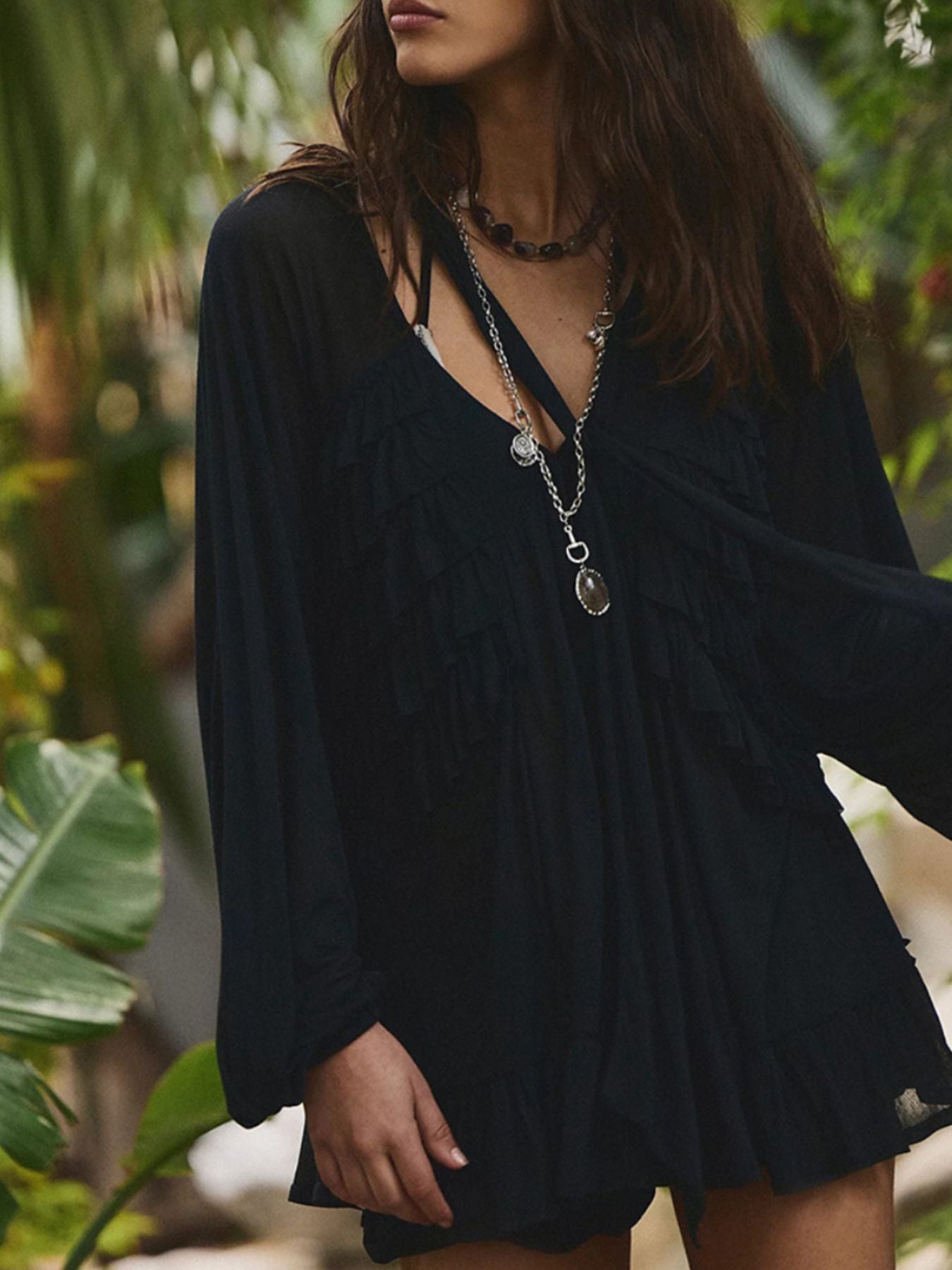 Black sheer ruffle trim beach cover-up with long sleeves and a V-neck.