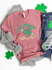 Pink graphic t-shirt with a retro shamrock and text that says Let's Get Shamrocked.