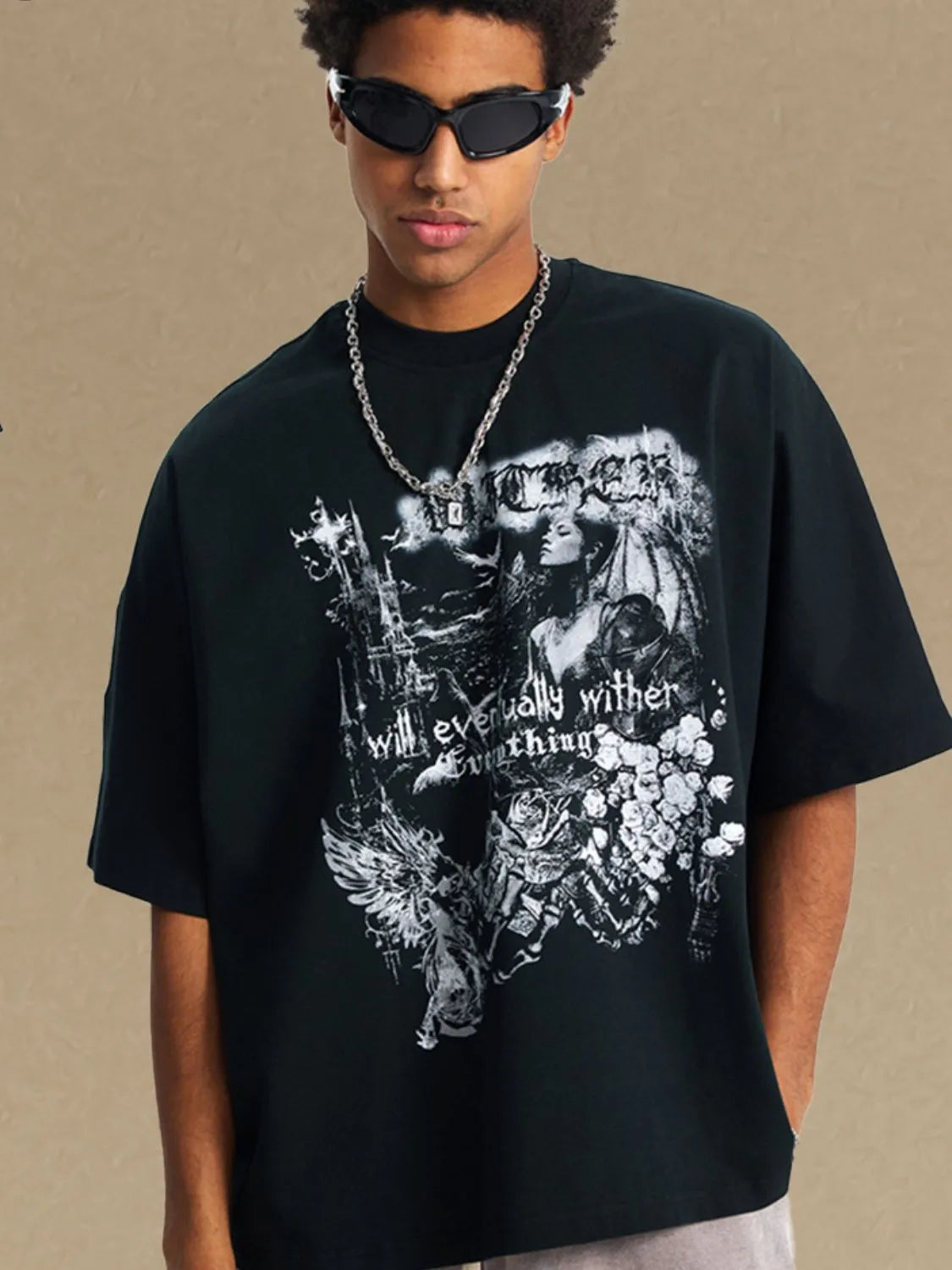 Black oversized graphic tee with gothic print and text.