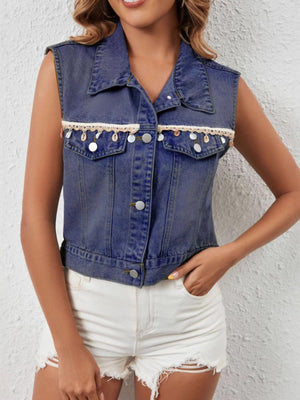 Classic button-up denim vest in dark blue with decorative trim and shell details.