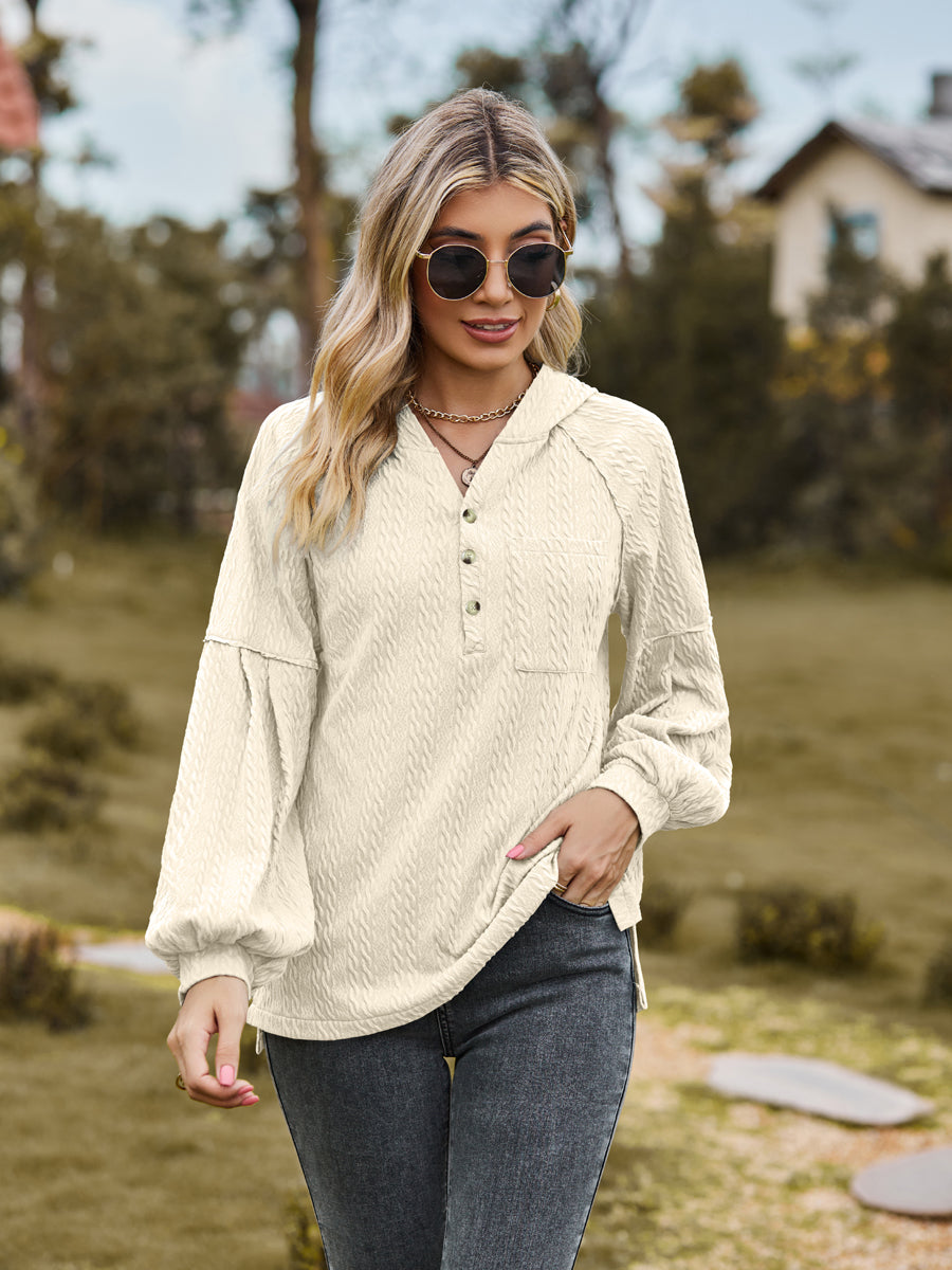 Cream textured knit henley with balloon sleeves and button detail