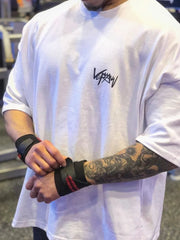 White oversized graphic tee with black logo, short sleeves, crew neck.