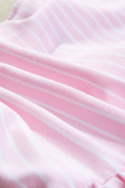 Blush pink striped peplum blouse with a textured fabric detail.
