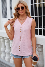 Blush pink perforated button-down sleeveless blouse with V-neck and wooden buttons.