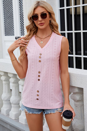 Blush pink perforated button-down sleeveless blouse with V-neck and wooden buttons.