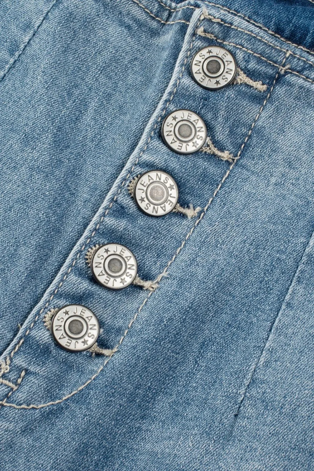 Button-fly wide-leg denim trousers in medium wash with branded silver buttons.