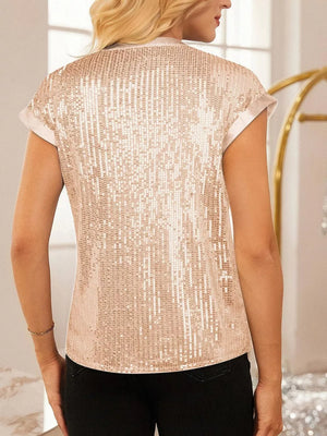 Dazzling sequin cap sleeve blouse in brass with satin trim.