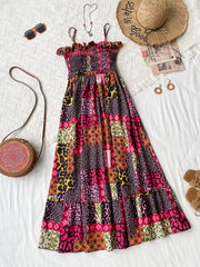 Frilled smocked leopard maxi dress with patchwork print, spaghetti straps, and tiered skirt.
