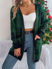 Plaid knit longline cardigan in dark green with black trim and pockets.