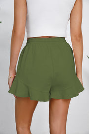 Green linen blend shorts with flounce hem and drawstring waist.