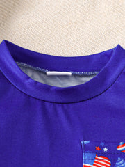 Baby tee with American flag pocket detail, round neck, short sleeves.