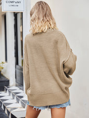 Oversized slouch knit V-neck sweater in cream, featuring a relaxed fit and breathable acrylic fabric.