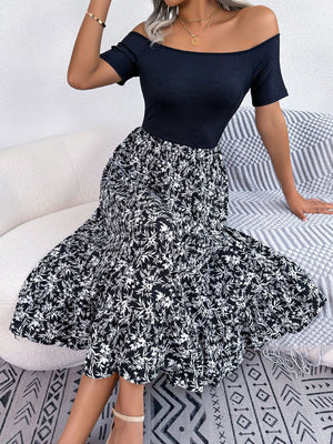 Black off-shoulder midi dress with a floral print skirt and short sleeves.