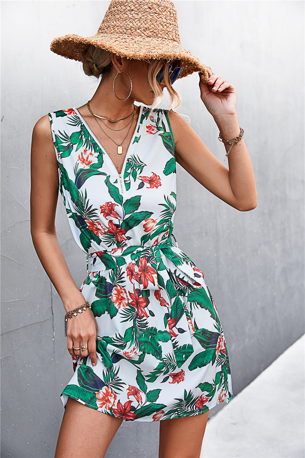 White floral zip-front mini dress with tie waist and green trim