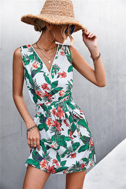 White floral zip-front mini dress with tie waist and green trim