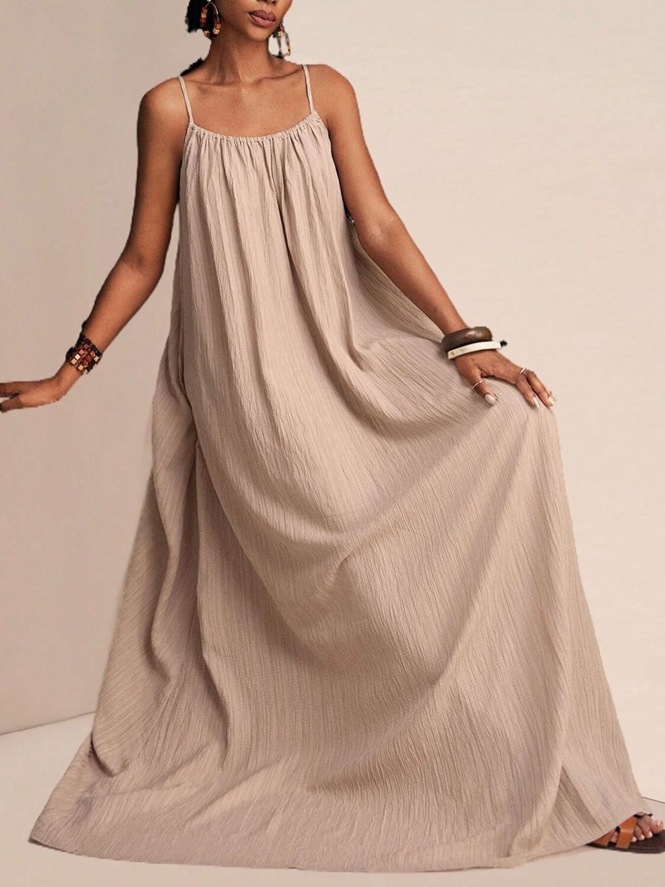 Khaki textured maxi swim dress with spaghetti straps and a gathered neckline.
