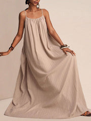 Khaki textured maxi swim dress with spaghetti straps and a gathered neckline.