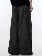 Relaxed fit black cargo pants with multiple pockets and a wide leg.