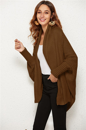 Brown cocoon knit cardigan with shawl collar and batwing sleeves.