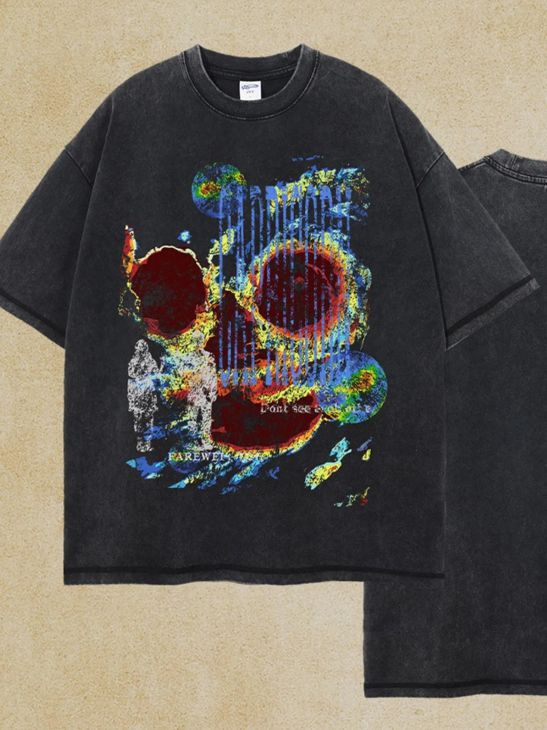 Black acid wash graphic t-shirt with abstract skull art and text details.