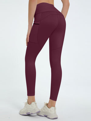 Burgundy pocketed sculpt leggings with a zippered side pocket and a high waist.