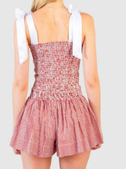 Strawberry smocked bodice and skirt set with white tie straps and red and white pinstripe skirt.
