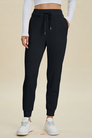 Black joggers with drawstring waist and cuffed ankles