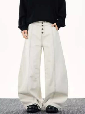 Relaxed fit wide leg button-fly jeans in off-white cotton with contrast stitching.