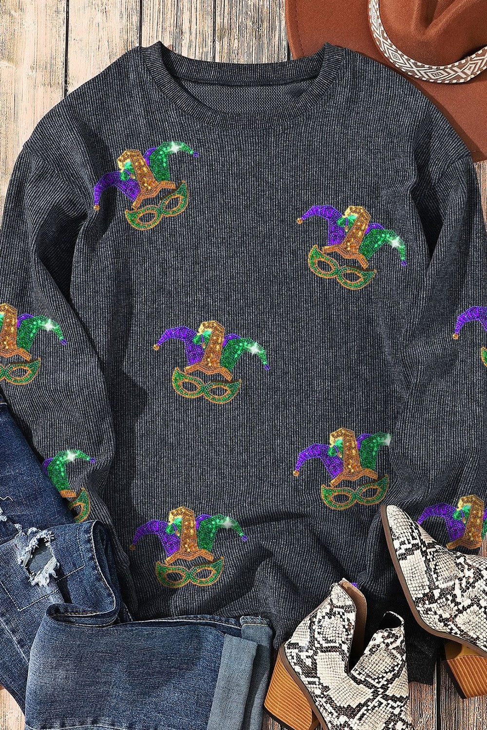 Black ribbed knit tunic with Mardi Gras hat and mask print.