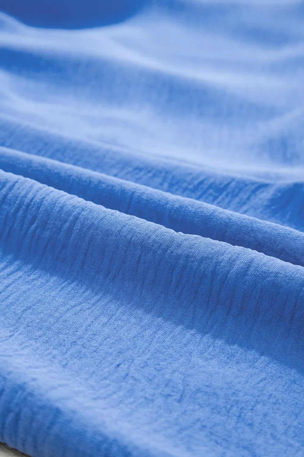 Blue crinkle fabric shorts with drawstring detail