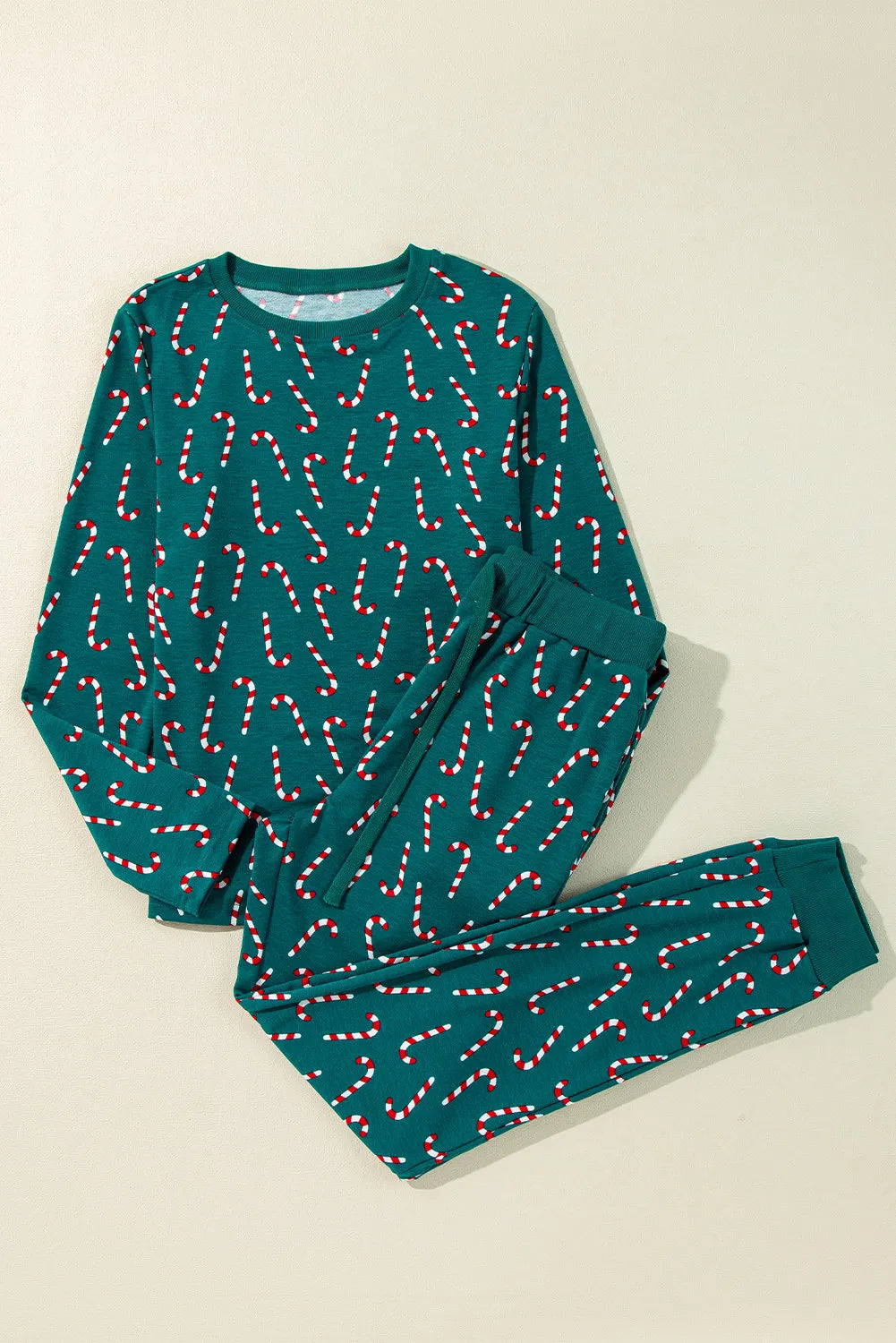 Candy cane print long sleeve pajama set in deep teal with crew neck and drawstring waist.