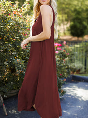 Burgundy asymmetrical hemline tank midi dress with a flowing skirt.
