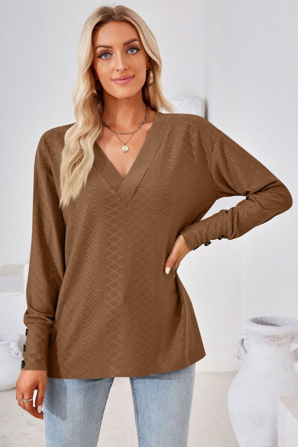 Brown textured V-neck blouse with button cuff long sleeves