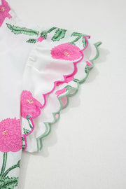 White cotton blouse with pink floral print and scalloped trim sleeves