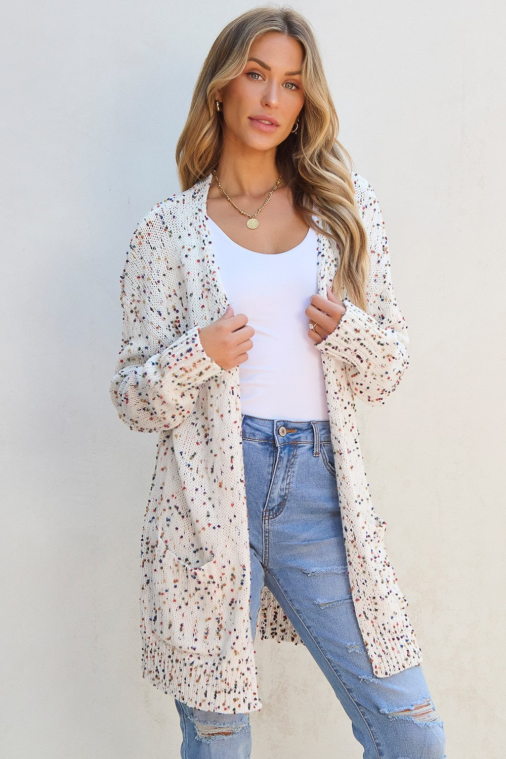 Confetti knit open-front cardigan in ivory with multicolor speckles and pockets.