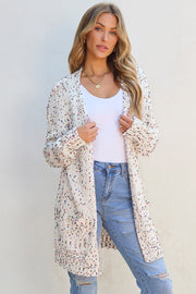 Confetti knit open-front cardigan in ivory with multicolor speckles and pockets.