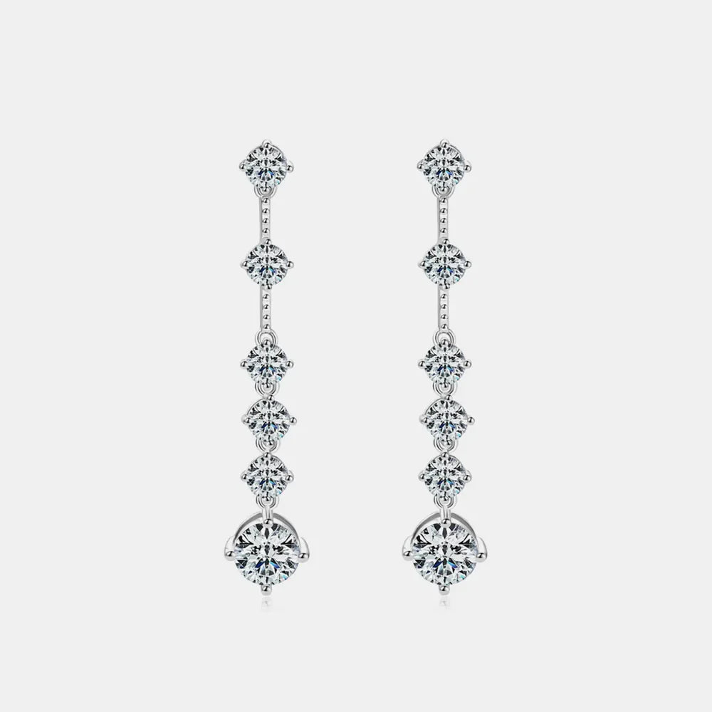 Silver cascading diamond drop earrings with multiple brilliant-cut stones.