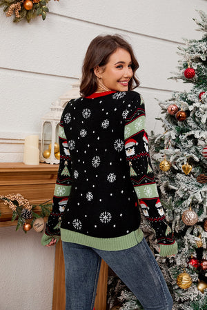 Black acrylic knit sweater with snowflakes and Santa Claus pattern.