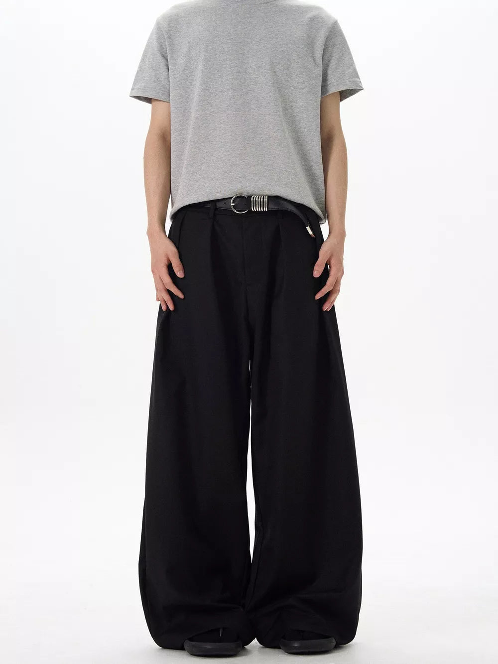 Black relaxed fit pleated men's sweatpants with a casual, comfortable style.