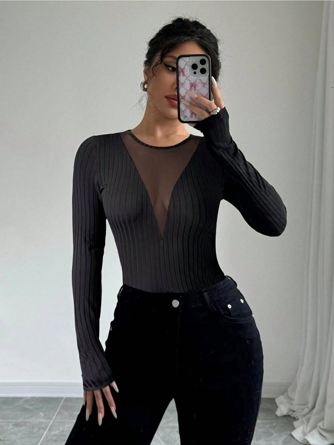 Black ribbed long sleeve bodysuit with plunging mesh neckline