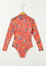 Orange mesh bodysuit with western print, long sleeves, and mock neck.
