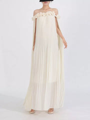 Cream off-shoulder maxi dress with floral applique neckline and cape sleeves.