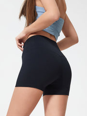 Black high-waisted active shorts with a seamless design and a fitted silhouette.