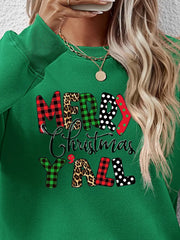Green crewneck sweatshirt with festive mixed print "Merry Christmas Y'all" graphic.