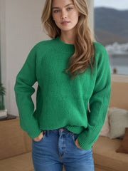 Dark green textured knit raglan sleeve pullover sweater with a mock neck and ribbed cuffs.