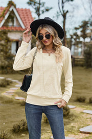 Textured knit sweater in ivory with square neckline and long sleeves.