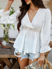 White Swiss dot wrap blouse with lace trim and tassel tie waist.
