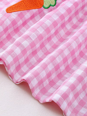 Pink gingham baby dress with carrot embroidery detail.