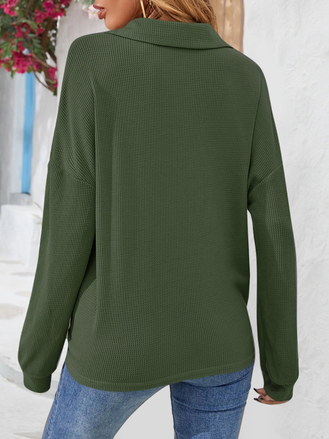 Army green waffle knit henley blouse with collar and long sleeves.