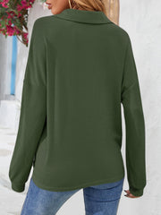 Army green waffle knit henley blouse with collar and long sleeves.